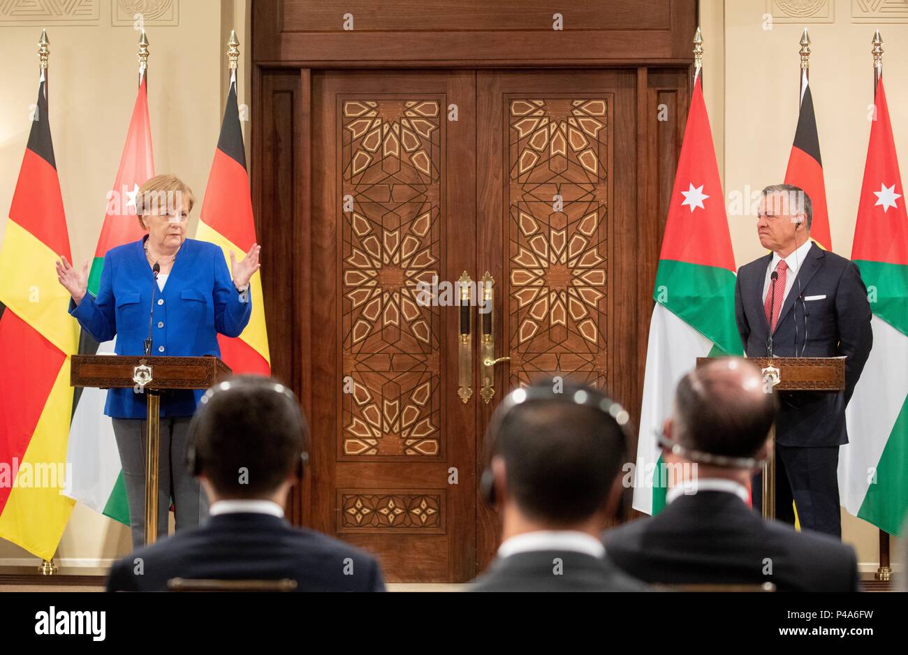 Amman, Jordan. 21st June, 2018. German Chancellor from the Christian Democratic Union (CDU), Angela Merkel, and the King of Jordan Abdullah II. speaking to journalists. The Chancellor will also be visiting Lebanon on her travels. Credit: Kay Nietfeld/dpa/Alamy Live News Stock Photo
