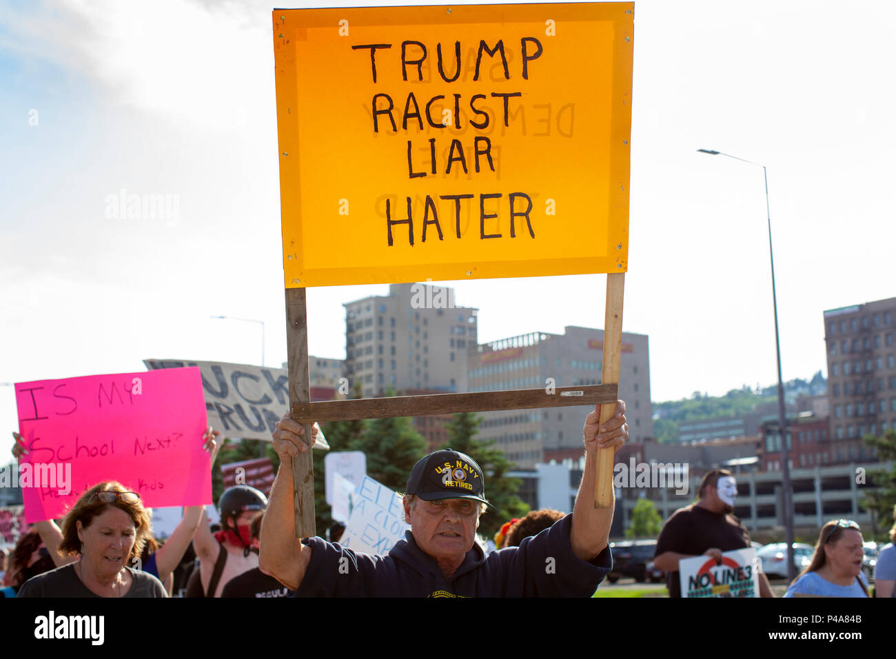 DULUTH, MINNESOTA, USA - June 20, 2018: A large crowd of protesters march in front of Amsoil arena while President Donald Trump speaks at a rally Wednesday night. Credit: Theresa Scarbrough/Alamy Live News Stock Photo