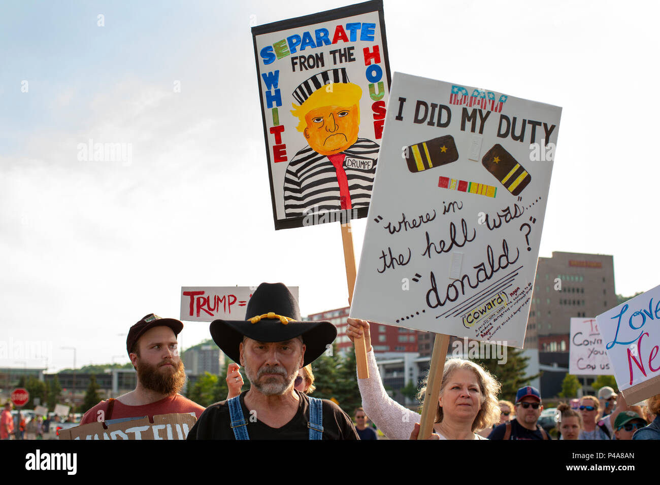 DULUTH, MINNESOTA, USA - June 20, 2018: A large crowd of protesters march in front of Amsoil arena while President Donald Trump speaks at a rally Wednesday night. Credit: Theresa Scarbrough/Alamy Live News Stock Photo