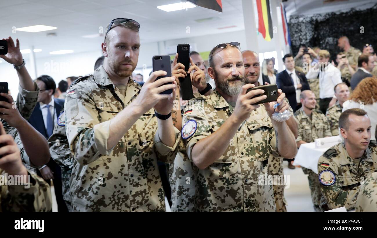 Amman, Jordan. 21st June, 2018. German Armed Forces soldiers photographing the German chancellor at the German air base near Amman. The Chancellor will also be visiting Lebanon on her travels. Credit: Kay Nietfeld/dpa/Alamy Live News Stock Photo