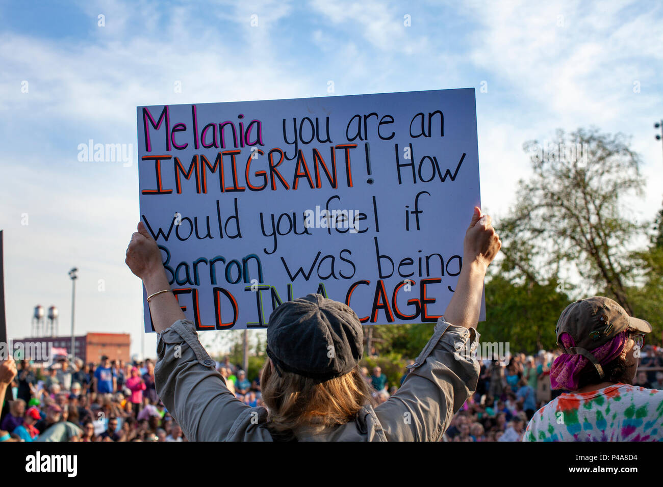 DULUTH, MINNESOTA, USA - June 20, 2018: A woman protester holds up her sign at Lakeside Park during the Democrat parties rally while President Donald Trump speaks at a rally Wednesday night. Credit: Theresa Scarbrough/Alamy Live News Stock Photo
