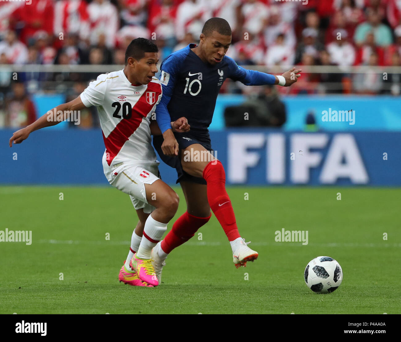 Yekaterinburg, Russia. 21st June, 2018. Edison Flores (L) of Peru vies with Kylian Mbappe of France during the 2018 FIFA World Cup Group C match between France and Peru in Yekaterinburg, Russia, June 21, 2018. Credit: Bai Xueqi/Xinhua/Alamy Live News Stock Photo