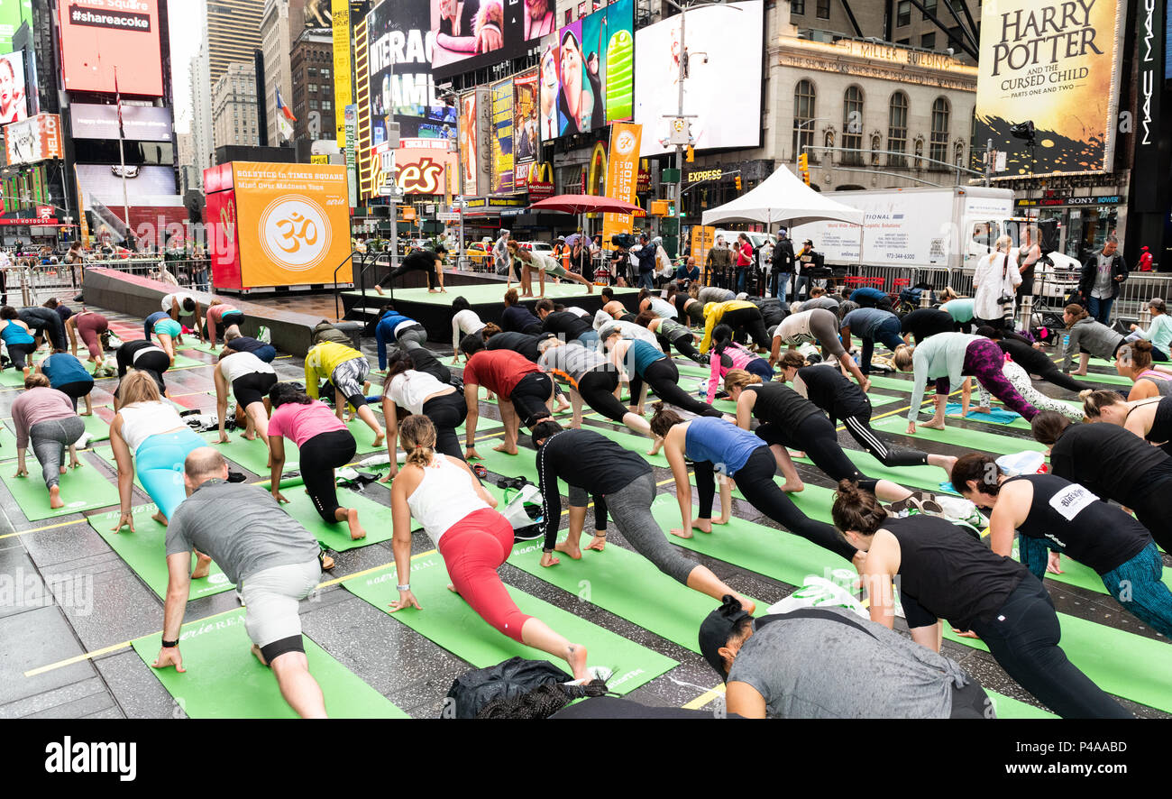 General view of people performing Yoga. Large yoga session in Times