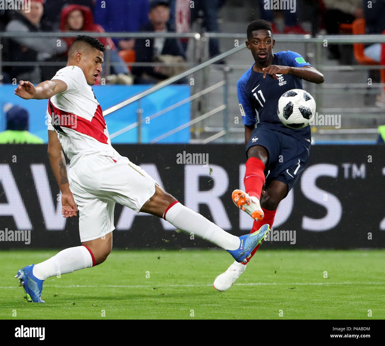 Yekaterinburg, Russia. 21st June, 2018. Anderson Santamaria (L) of Peru vies with Ousmane Dembele of France during the 2018 FIFA World Cup Group C match between France and Peru in Yekaterinburg, Russia, June 21, 2018. France won 1-0. Credit: Bai Xueqi/Xinhua/Alamy Live News Stock Photo