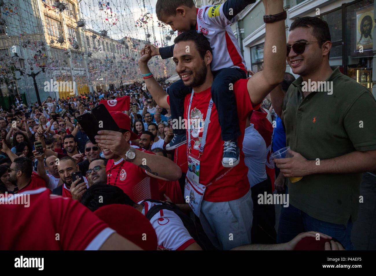 Moscow, Russia. 21st June, 2018. Tunisian football fans sing and cheer on Nikolskaya street during The World Cup Tournament in Moscow, Russia Stock Photo