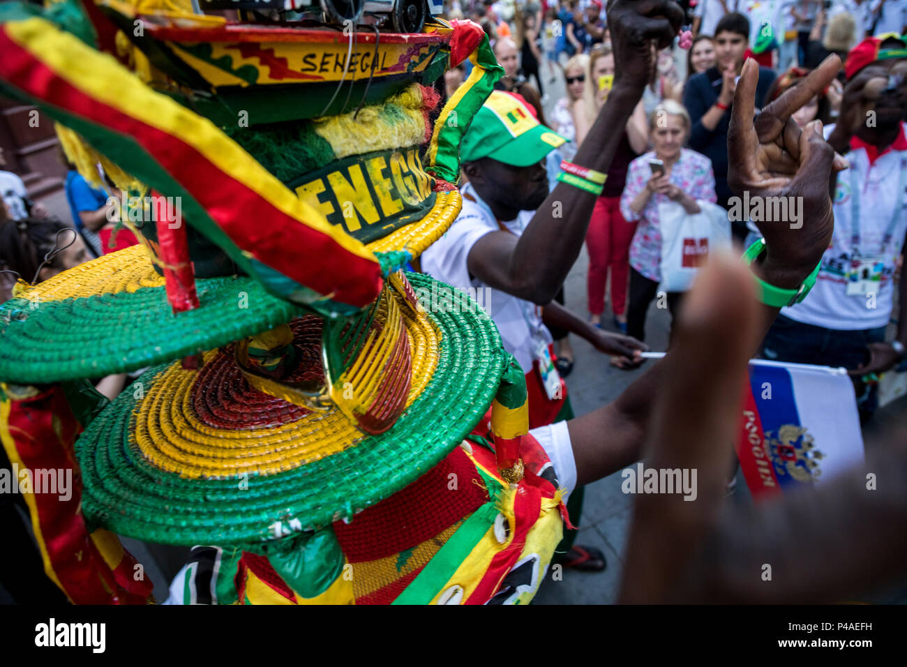 Moscow, Russia. 21st June, 2018. Senegalese football fans sing and cheer on Nikolskaya street in central Moscow during the 2018 FIFA World Cup Russia Stock Photo
