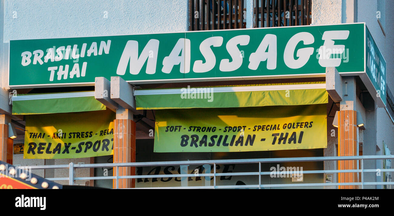 A sign offering Brazilian and and Thai massage. Algarve is a popular  destination for Brits Stock Photo - Alamy