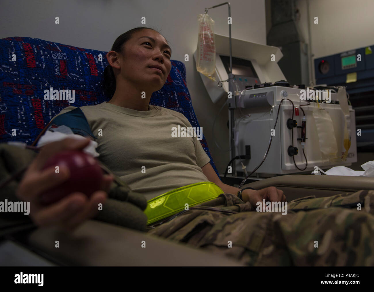 Capt. Kellyanne Matsuoka, 455th Expeditionary Aircraft Maintenance Squadron operations officer, donates blood during an urgent need for blood donations, June 24, 2016, Bagram Airfield, Afghanistan. In an urgent call from the Craig Joint-Theater Hospital, all pre-screened personnel with B type blood reported to the hospital to donate blood. (U.S. Air Force photo by Senior Airman Justyn M. Freeman) Stock Photo