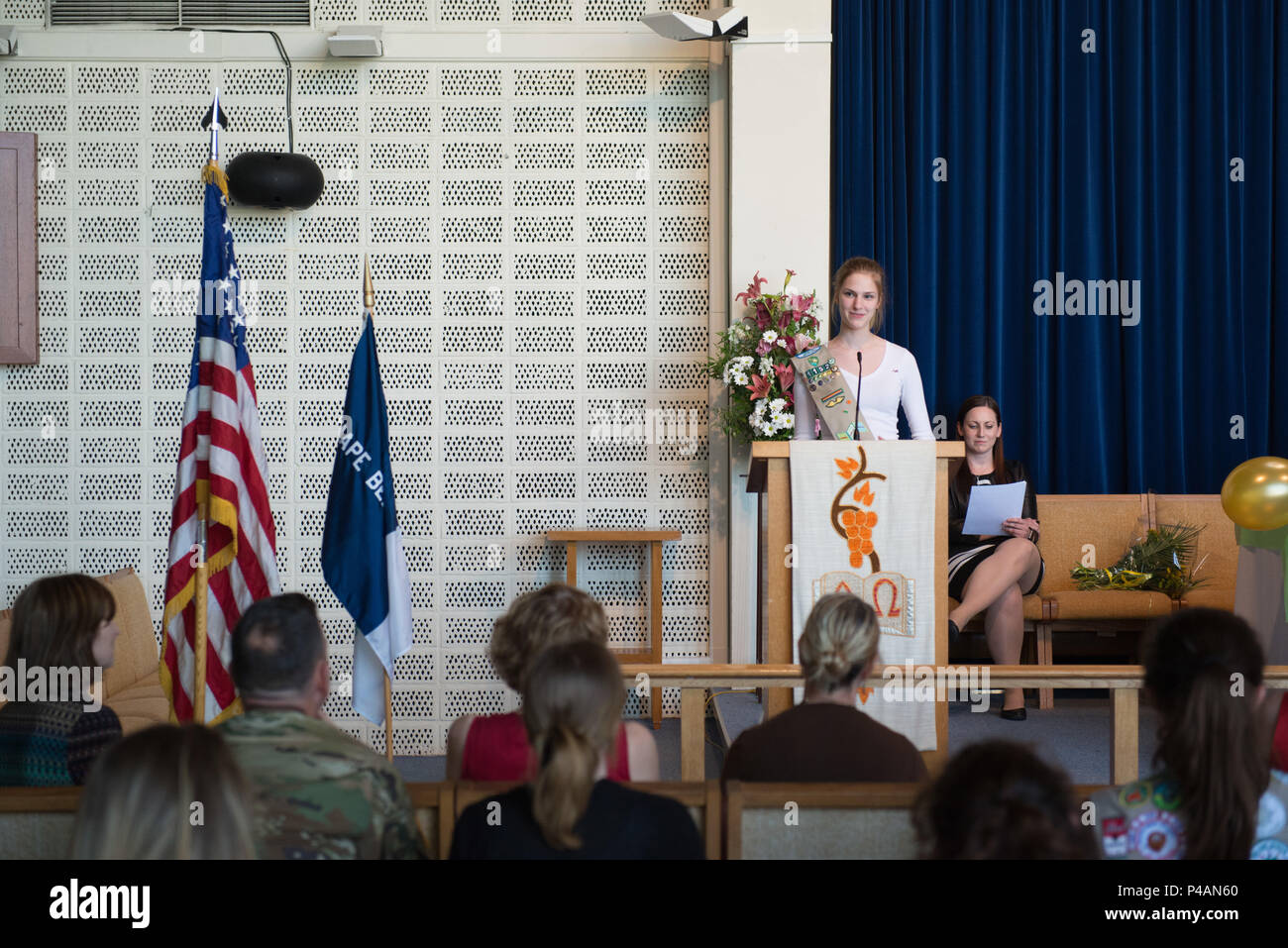 Lizzie Morrow, with U.S.A. Girl Scouts Overseas, SHAPE neighborhood, explains the project that