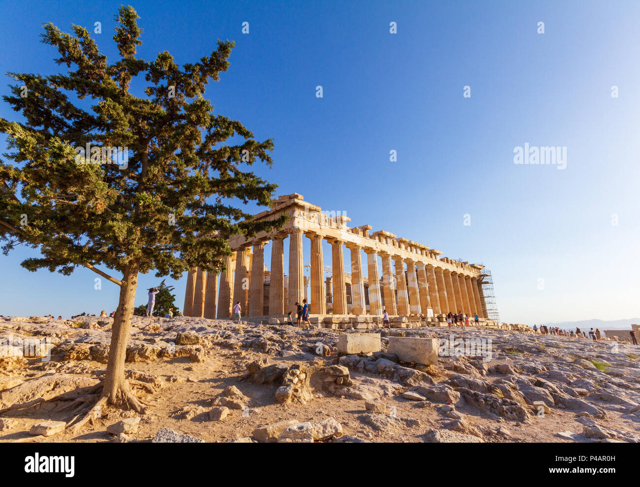 Athens, Greece - June 9, 2018: Tourists walking around and taking photos of the Parthenon on the Acropolis Stock Photo