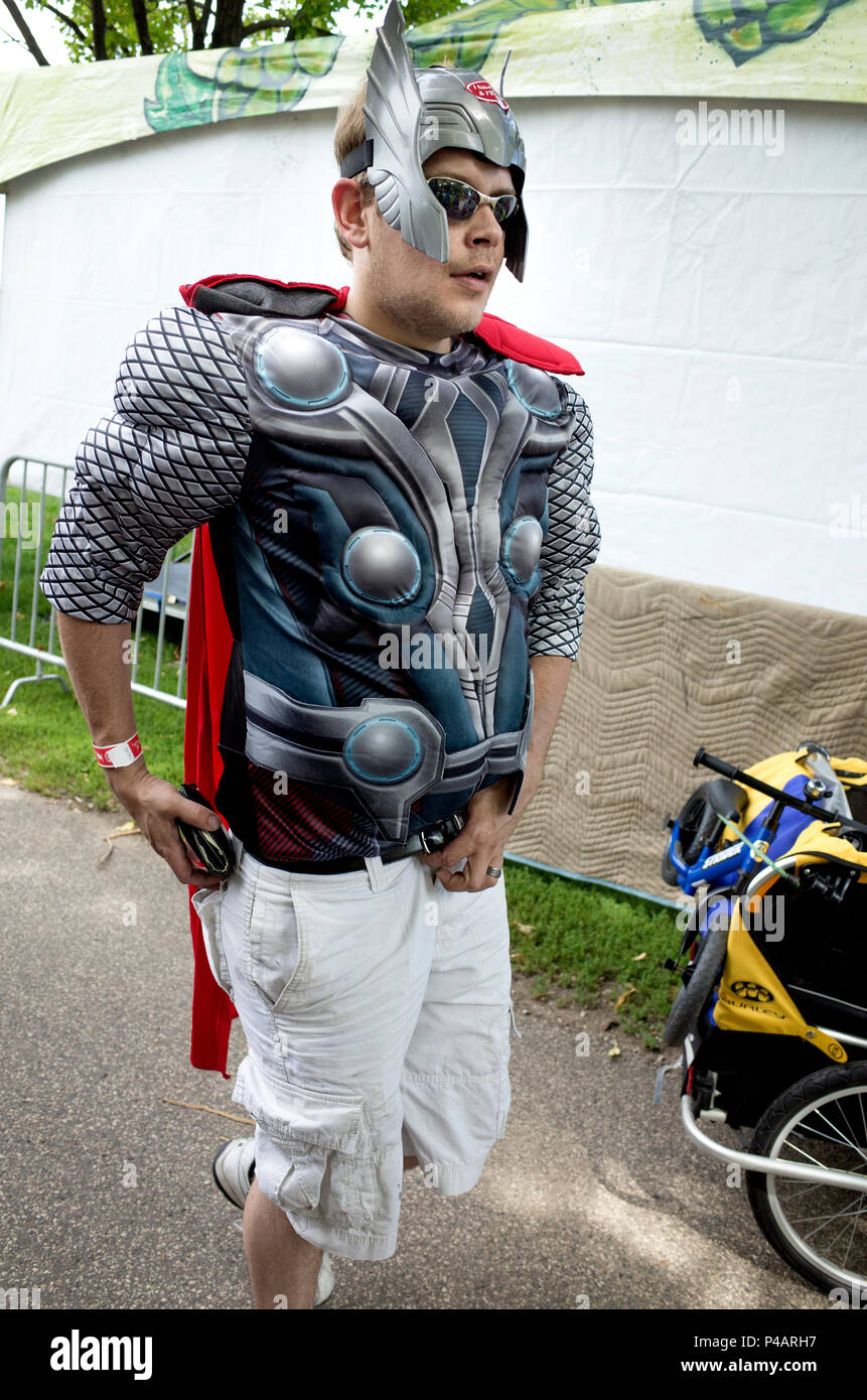 Man dressed in gladiator costume, red cape and winged helmet participating in the Tour de Fat festival in Loring Park. Minneapolis Minnesota MN USA Stock Photo