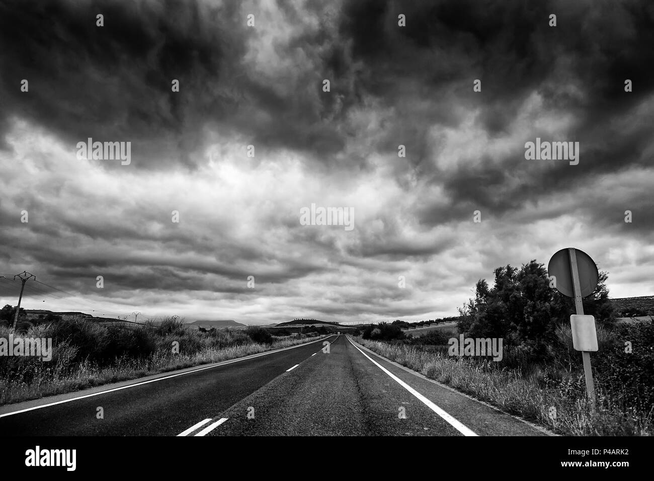 Mountain road on a stormy day, detail of a route by road, transport and travel Stock Photo