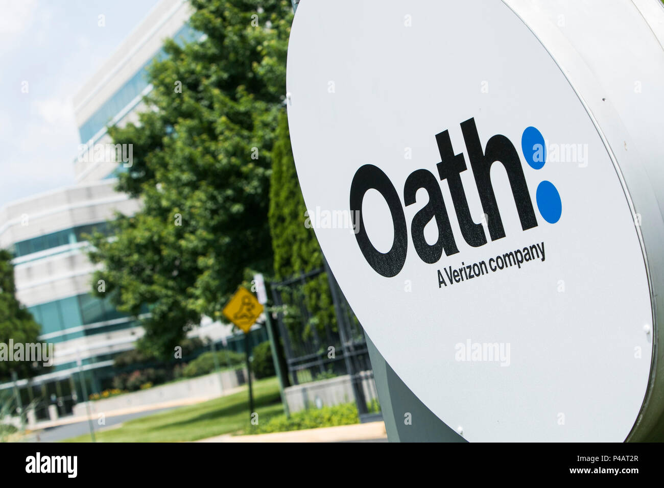 A logo sign outside of a facility occupied by Oath Inc., in Dulles