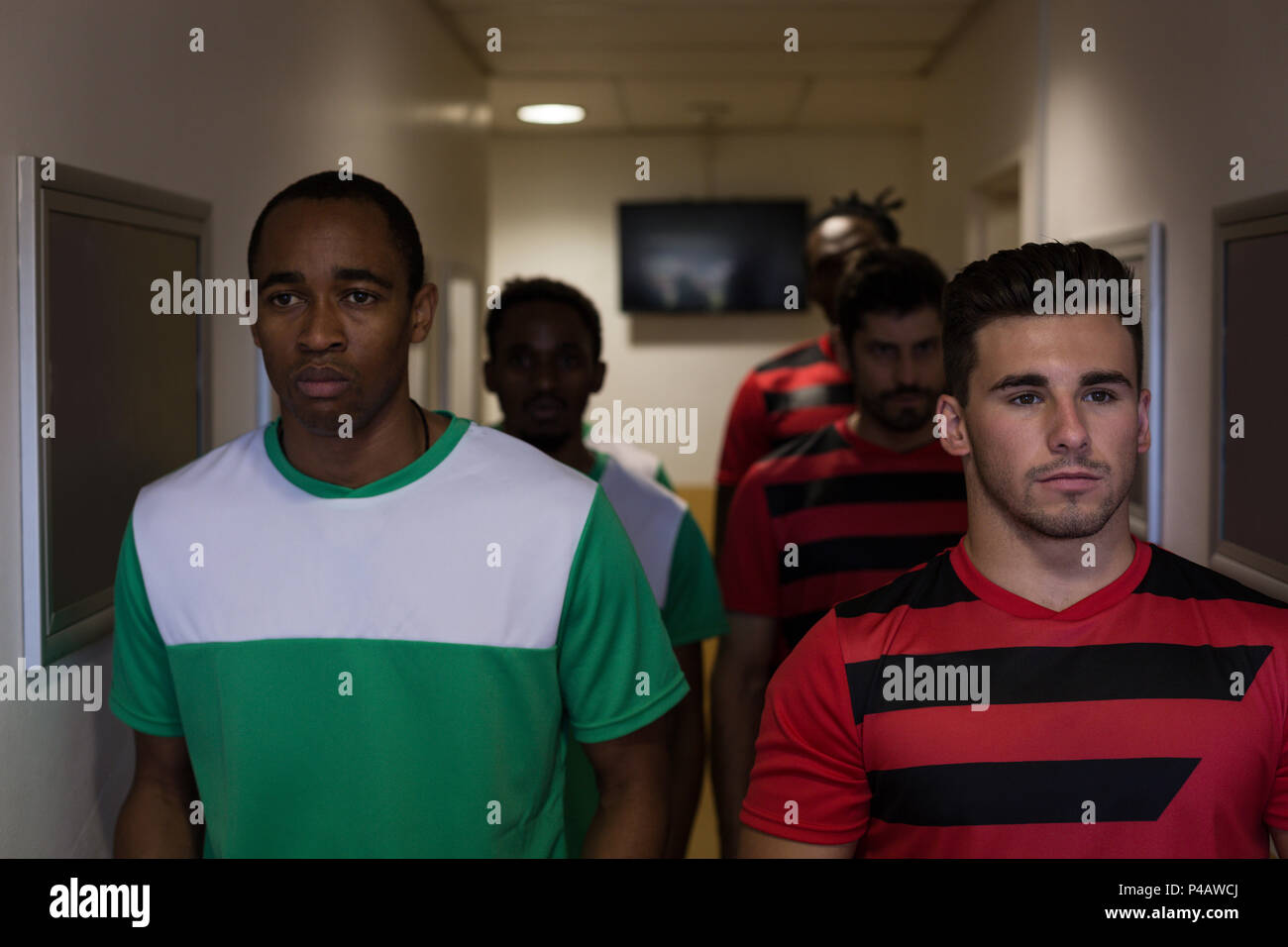 Football players leaving the dressing room Stock Photo