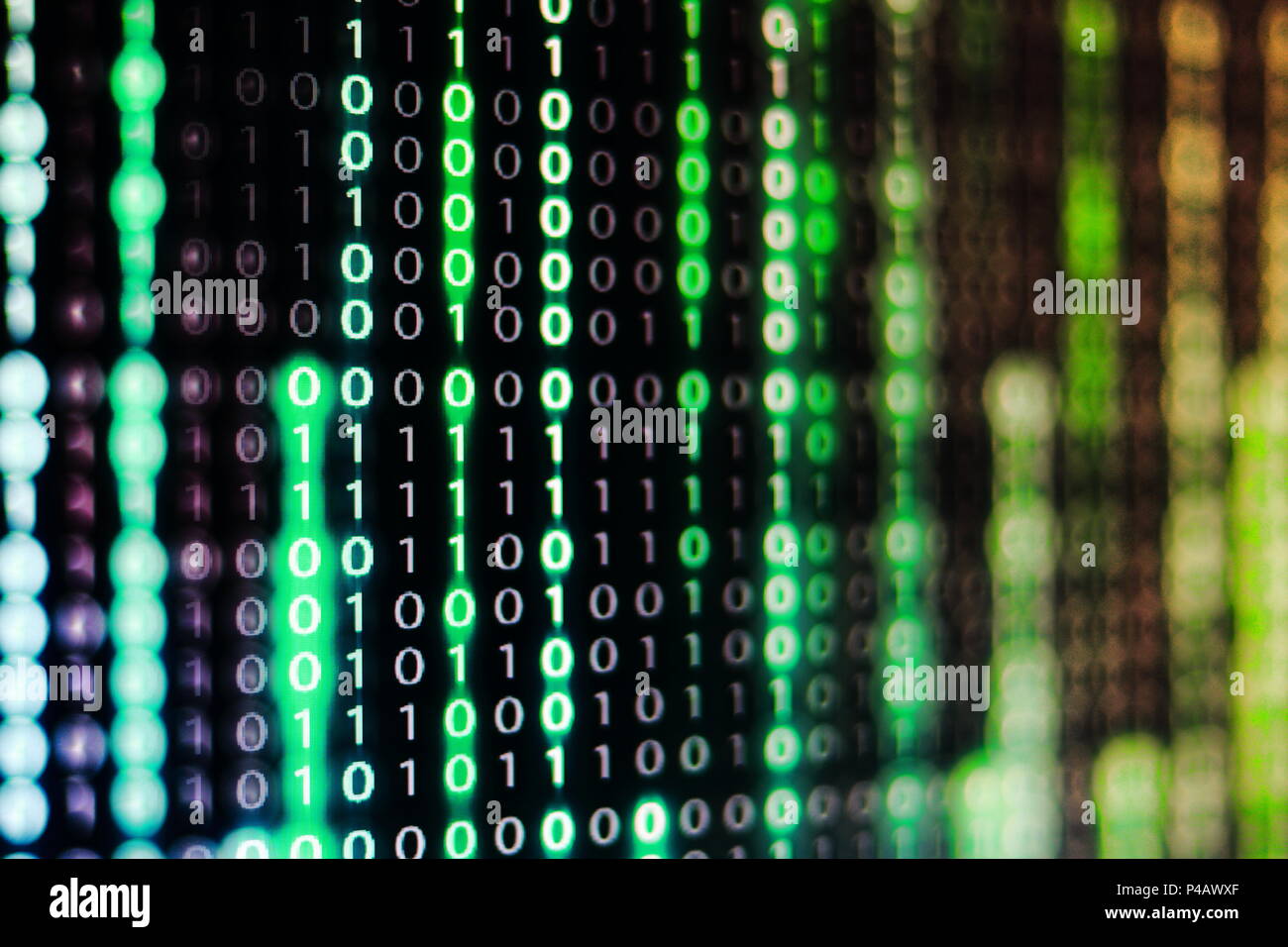 power of big data. binary code information bit on computer monitor ...