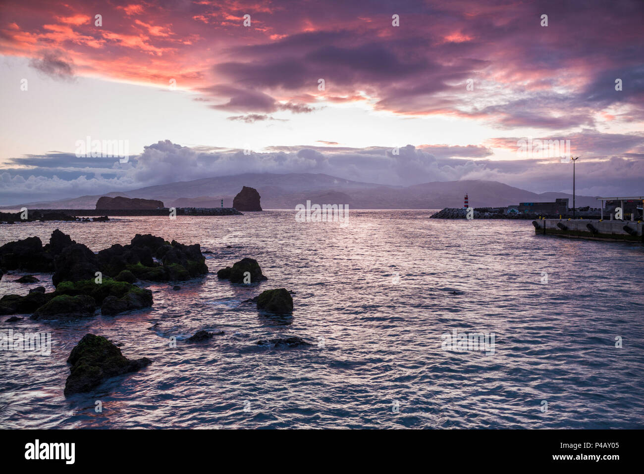 Portugal, Azores, Pico Island, Madalena, sunset over the port Stock ...