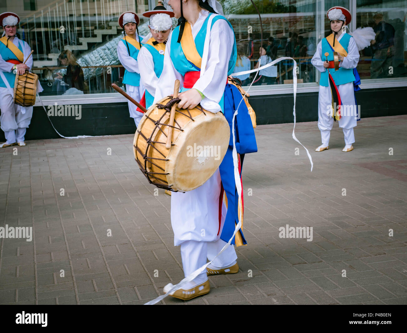 Moscow, Russia, July 12, 2018: Korean traditional musical instruments. A group of musicians and dancers in bright colored suits perform traditional Ko Stock Photo