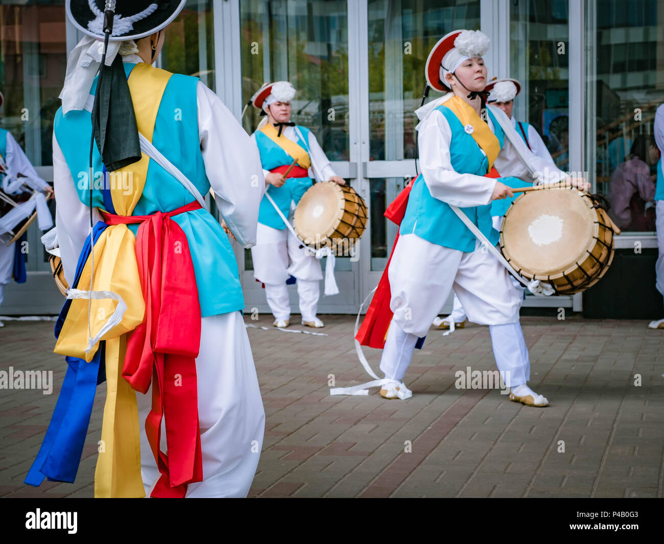 Moscow, Russia, July 12, 2018: Korean traditional musical instruments. A group of musicians and dancers in bright colored suits perform traditional Ko Stock Photo