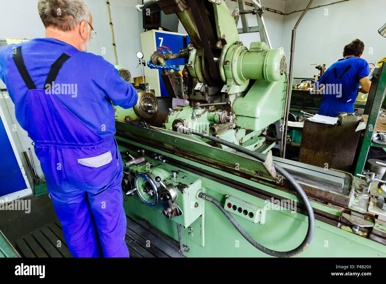 Two technicians working in factory Stock Photo