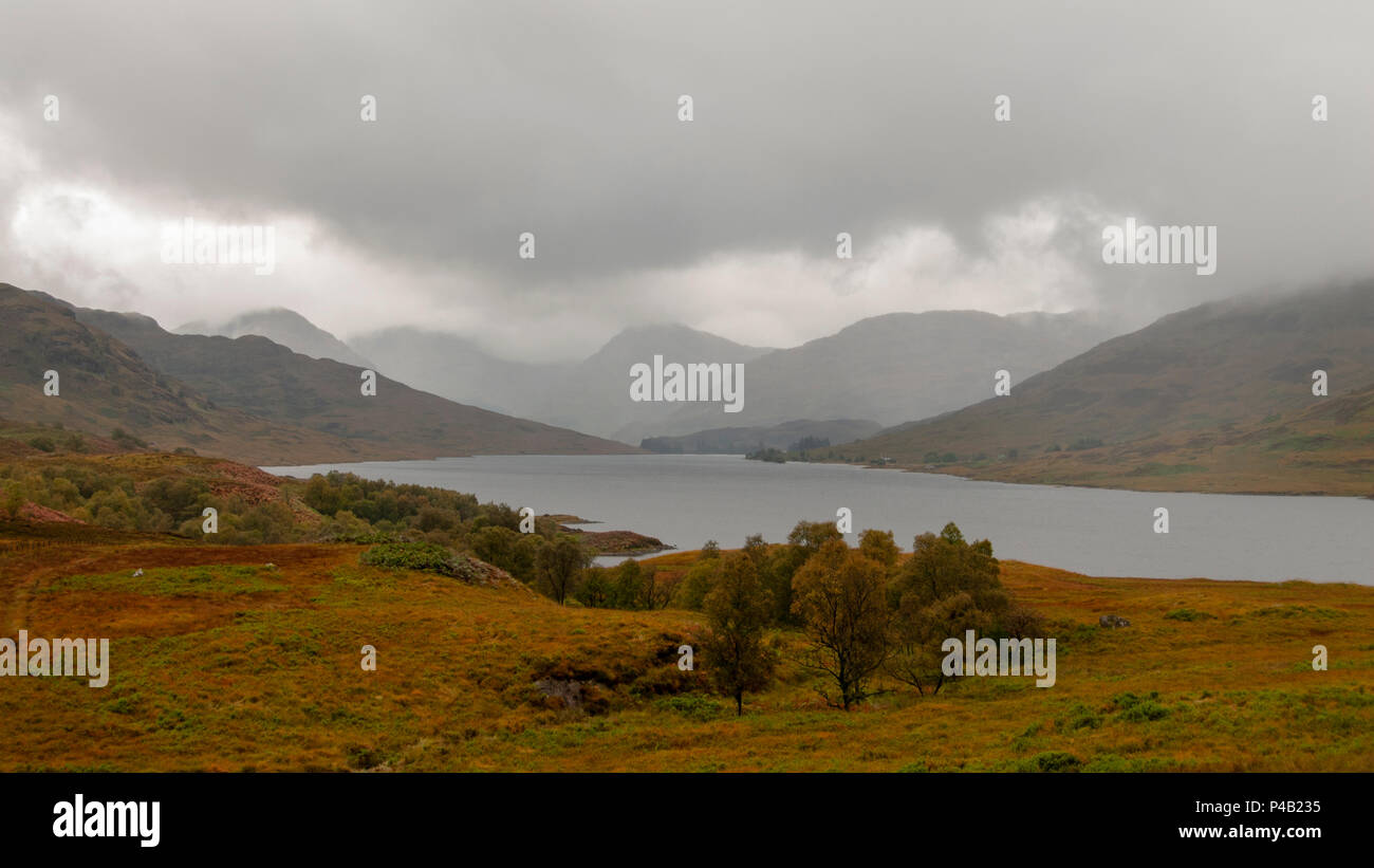 Panorama view of Loch Arklet  - gathering autumnal storm clouds and first signs of rain, near Stronachlachar, Loch Lomond & The Trossachs, Scotland Stock Photo