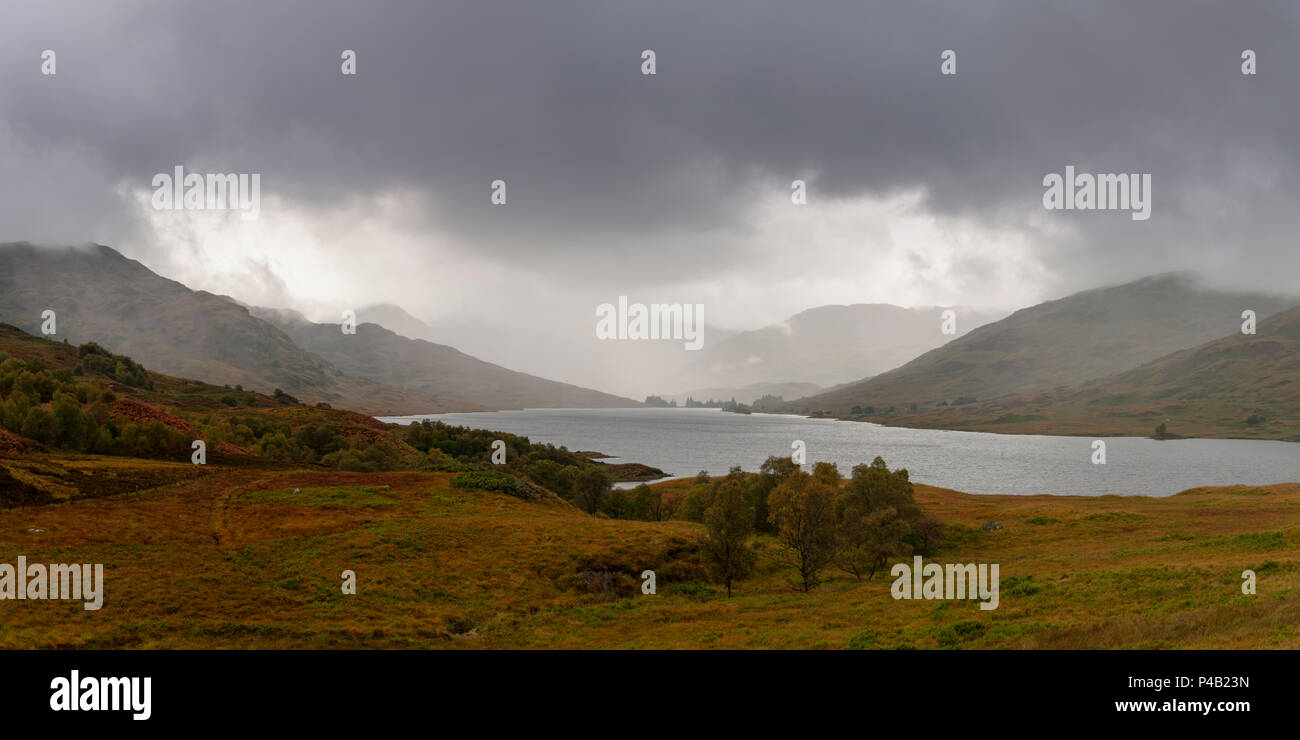 Panorama view of Loch Arklet  - gathering autumnal storm clouds and first signs of rain, near Stronachlachar, Loch Lomond & The Trossachs, Scotland Stock Photo