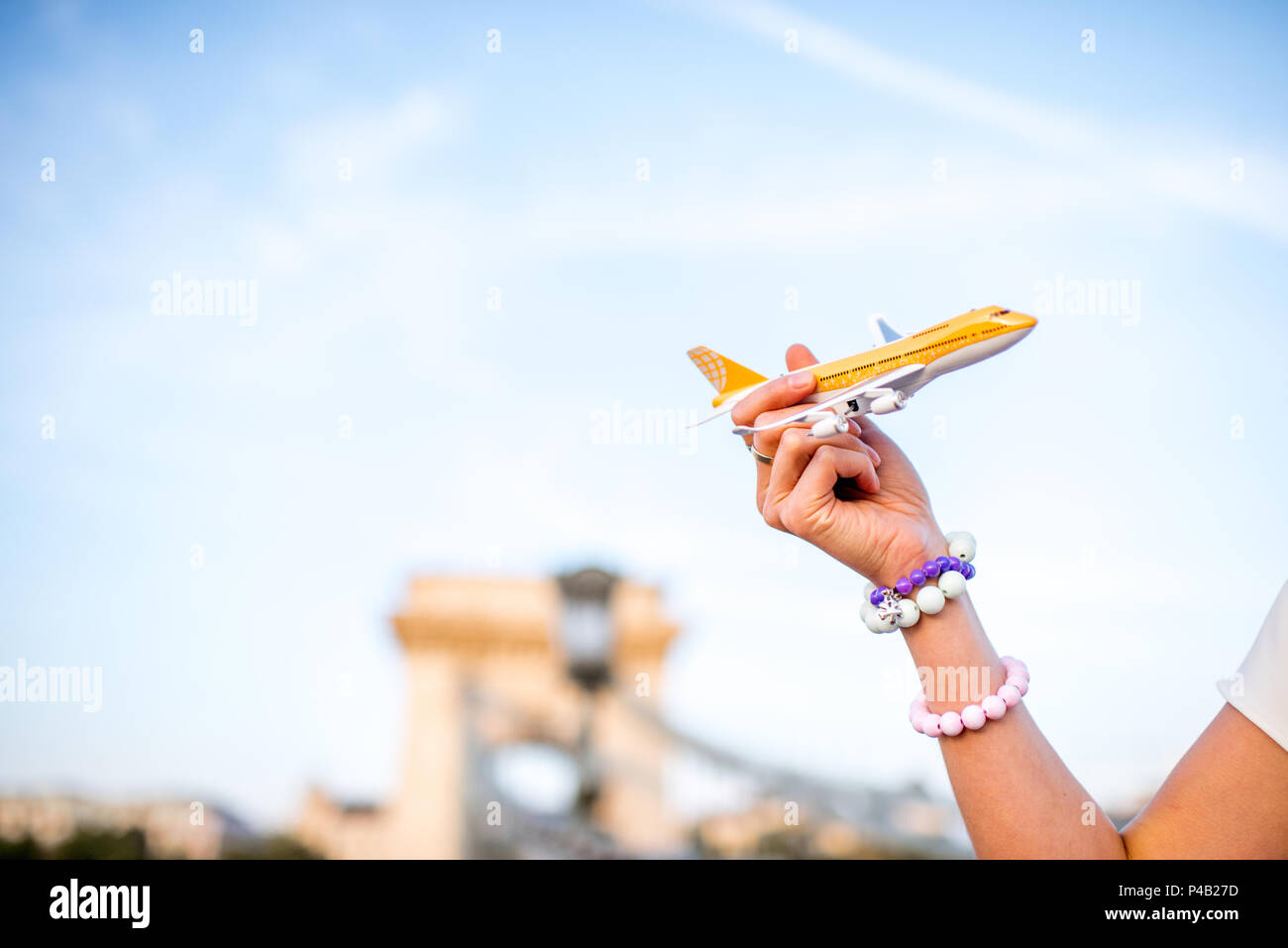 Flying with toy airplane in Budapest Stock Photo