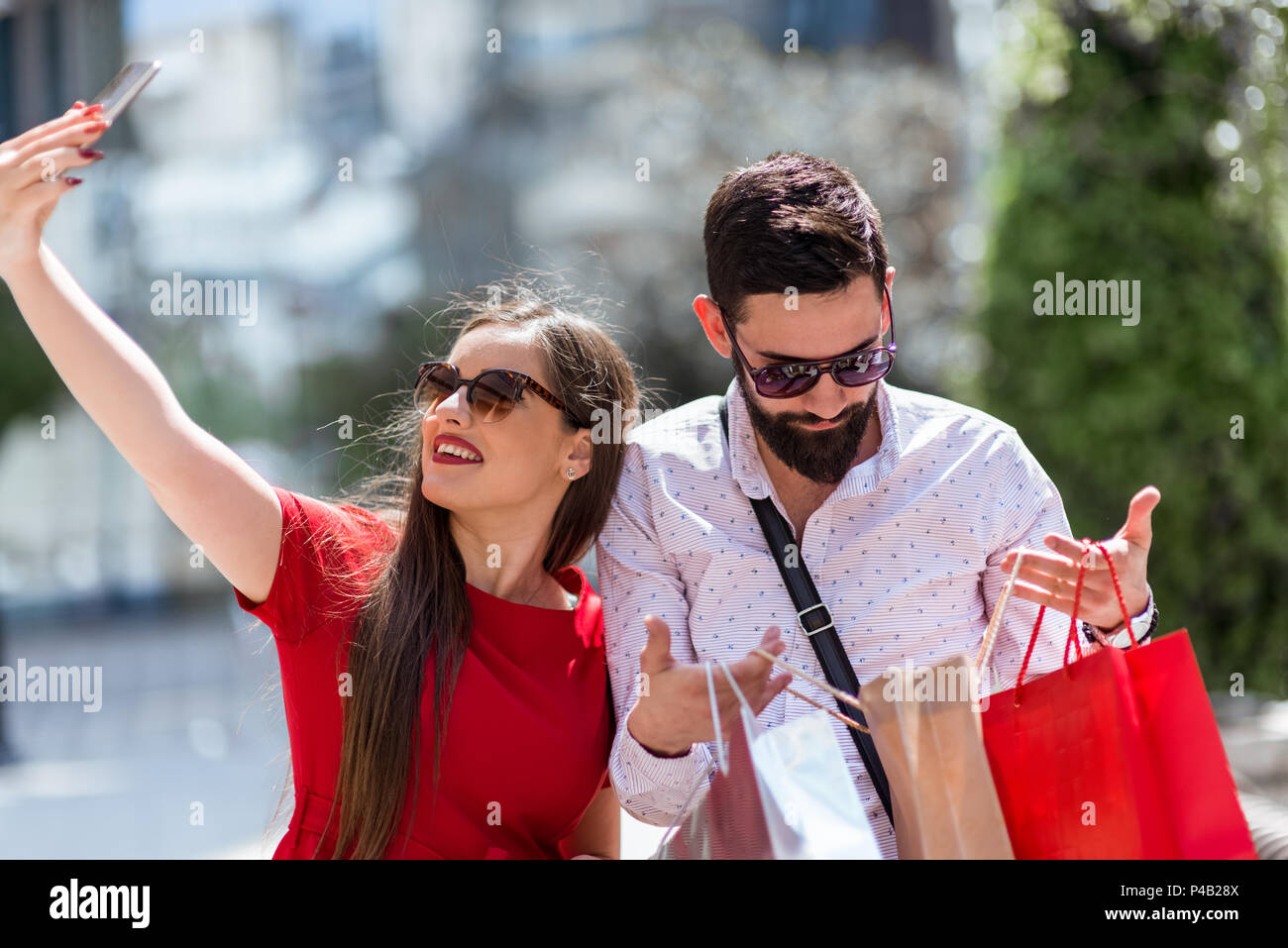 Shoping in the city.Loverly couple having fun on the Macedonian streets. Stock Photo