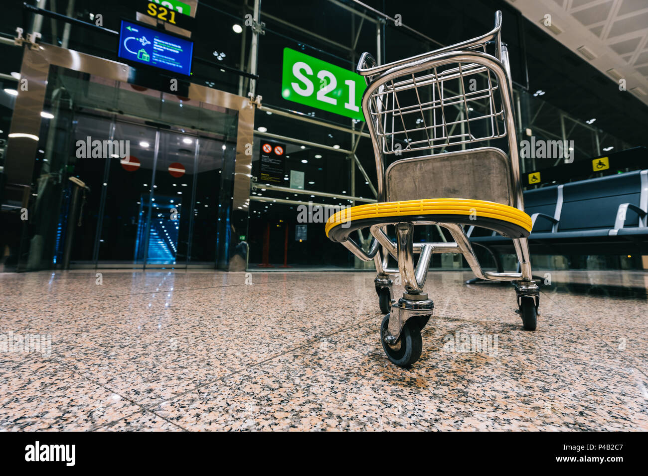 Luggage cart trolley at modern airport gate Stock Photo Alamy