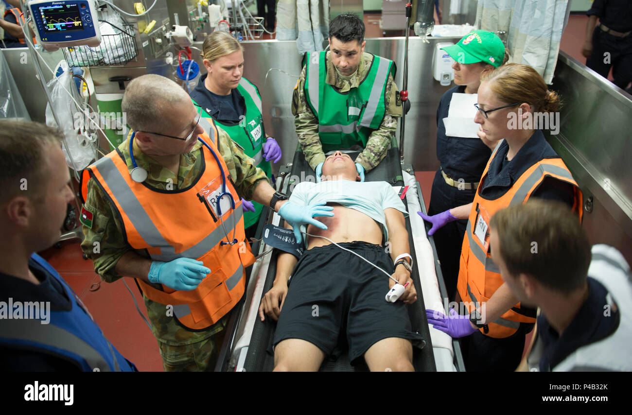 160624-N-QW941-169  PHILIPPINES SEA (June 24, 2016) Personnel conduct contusion training during a mass casualty drill aboard hospital ship USNS Mercy (T-AH 19). Deployed in support of Pacific Partnership 2016, medical, engineering and various other personnel embarked aboard Mercy are working side-by-side with partner nation counterparts, exchanging ideas, building best practices and relationships to ensure preparedness should disaster strike. (U.S. Navy photo by Mass Communication Specialist 3rd Class Trevor Kohlrus/Released) Stock Photo