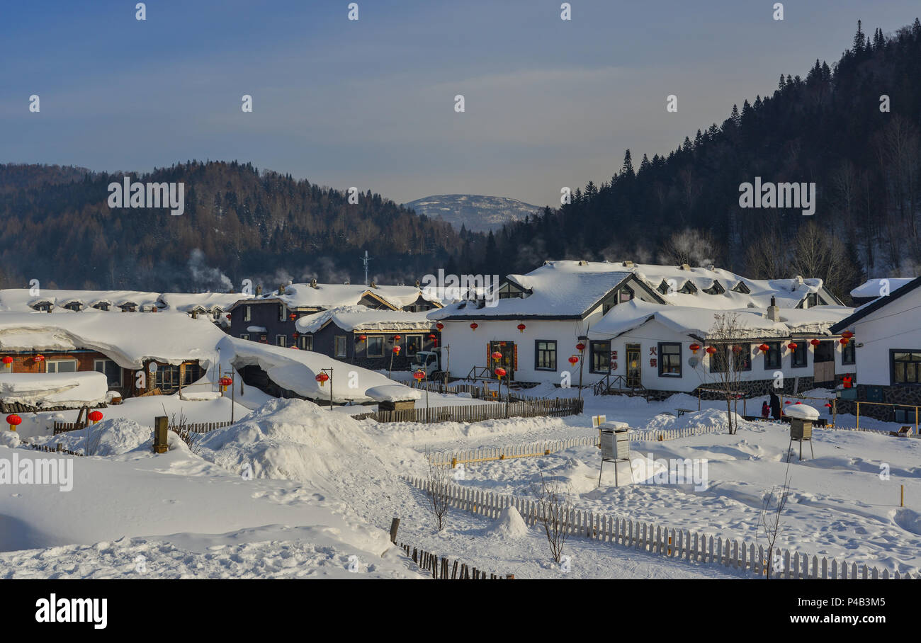 Harbin, China Feb 24, 2018. Wooden houses located at mountain snow