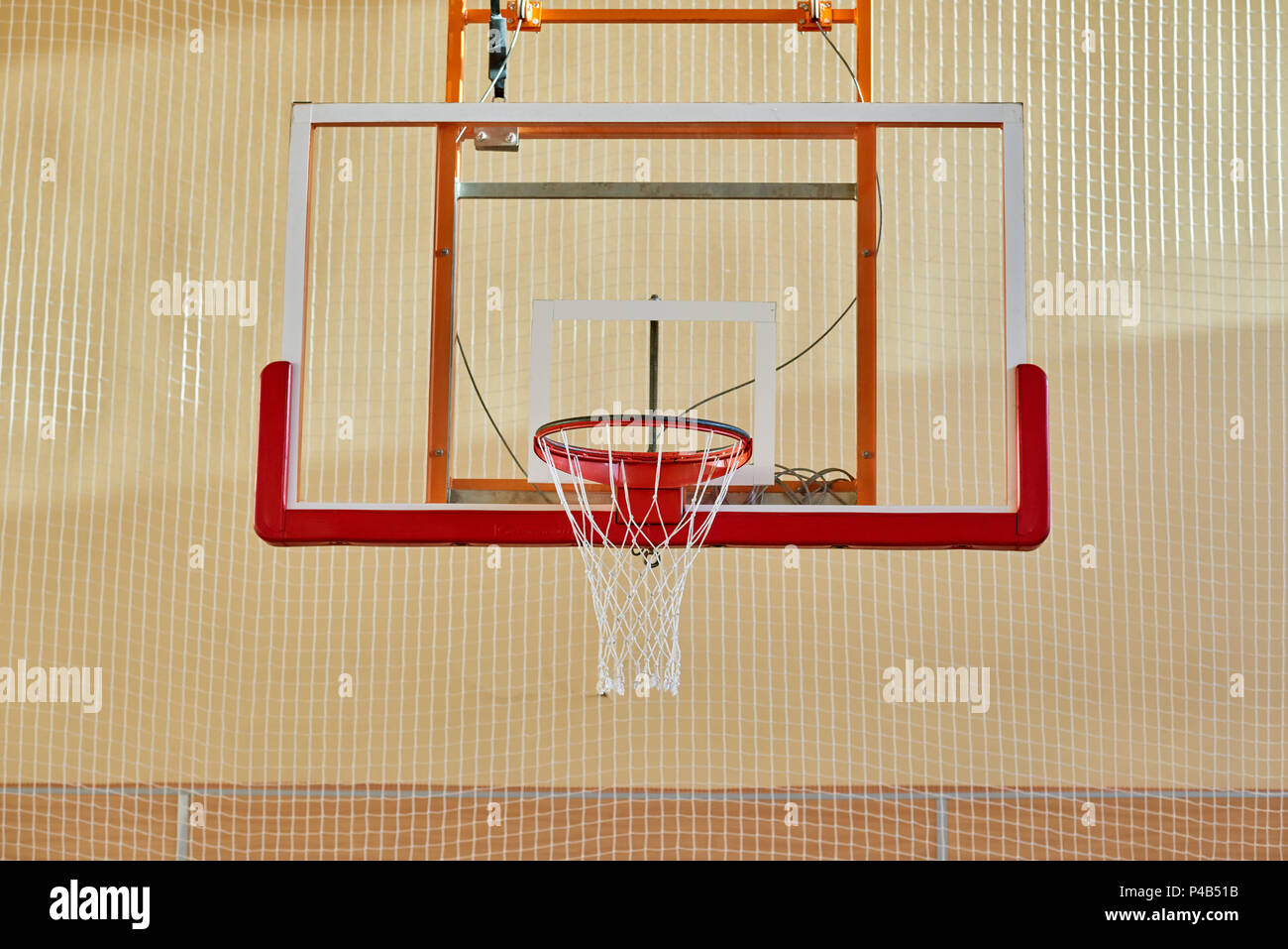 Basketball backboard in gym Stock Photo