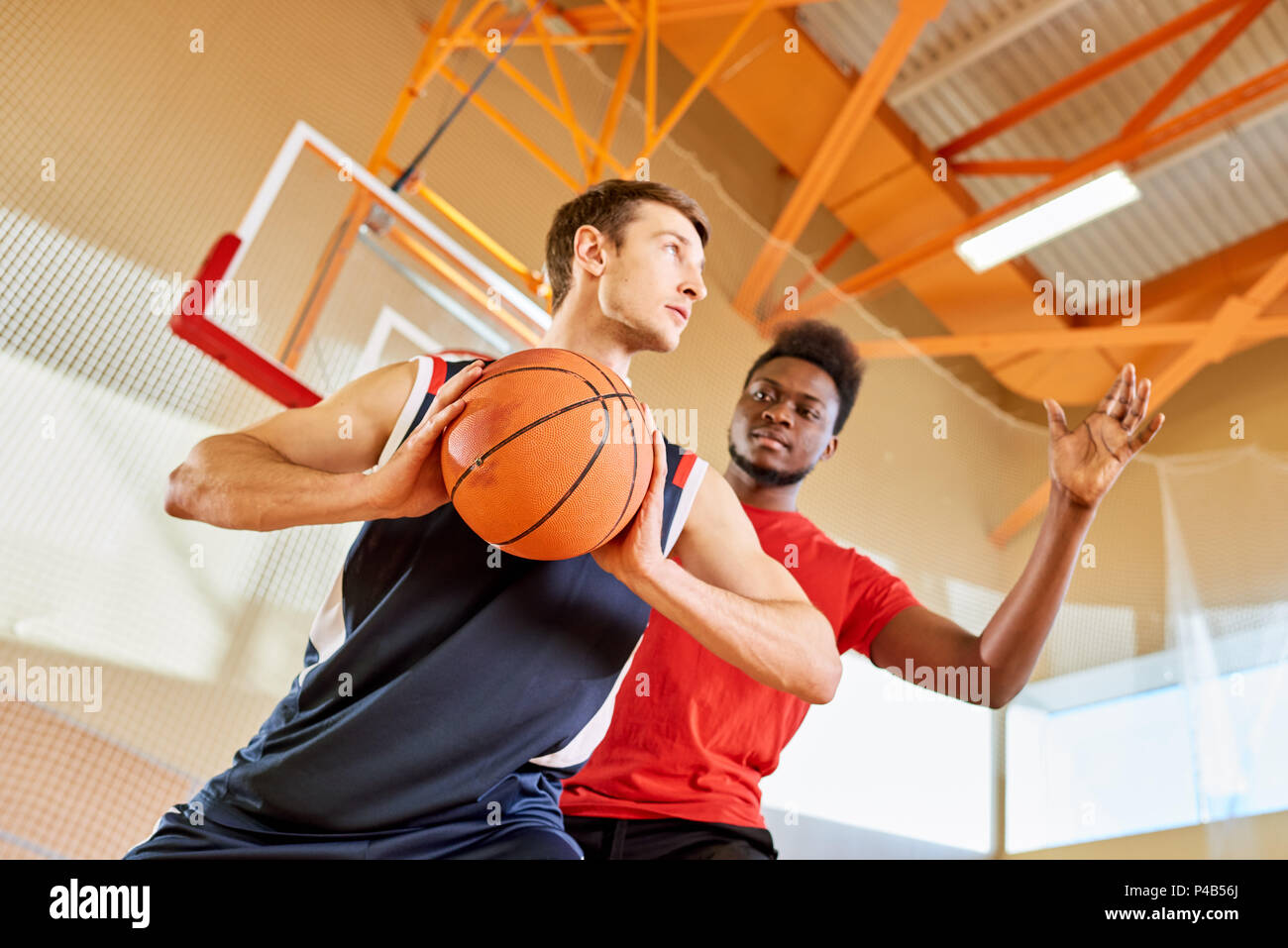 Two sportsmen playing basketball Stock Photo