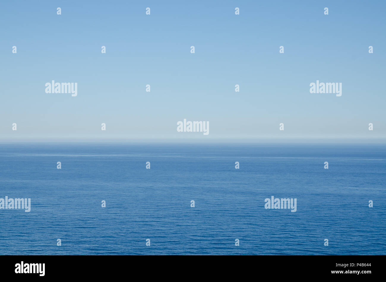 Simple background of blue Mediterranean sea against clear blue sky. Stock Photo