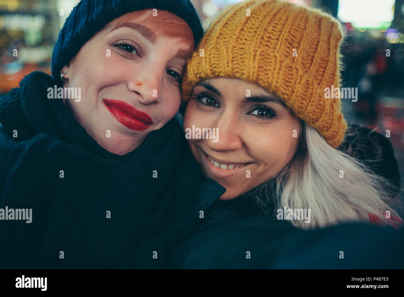 Two girlfriends on times square new york Stock Photo
