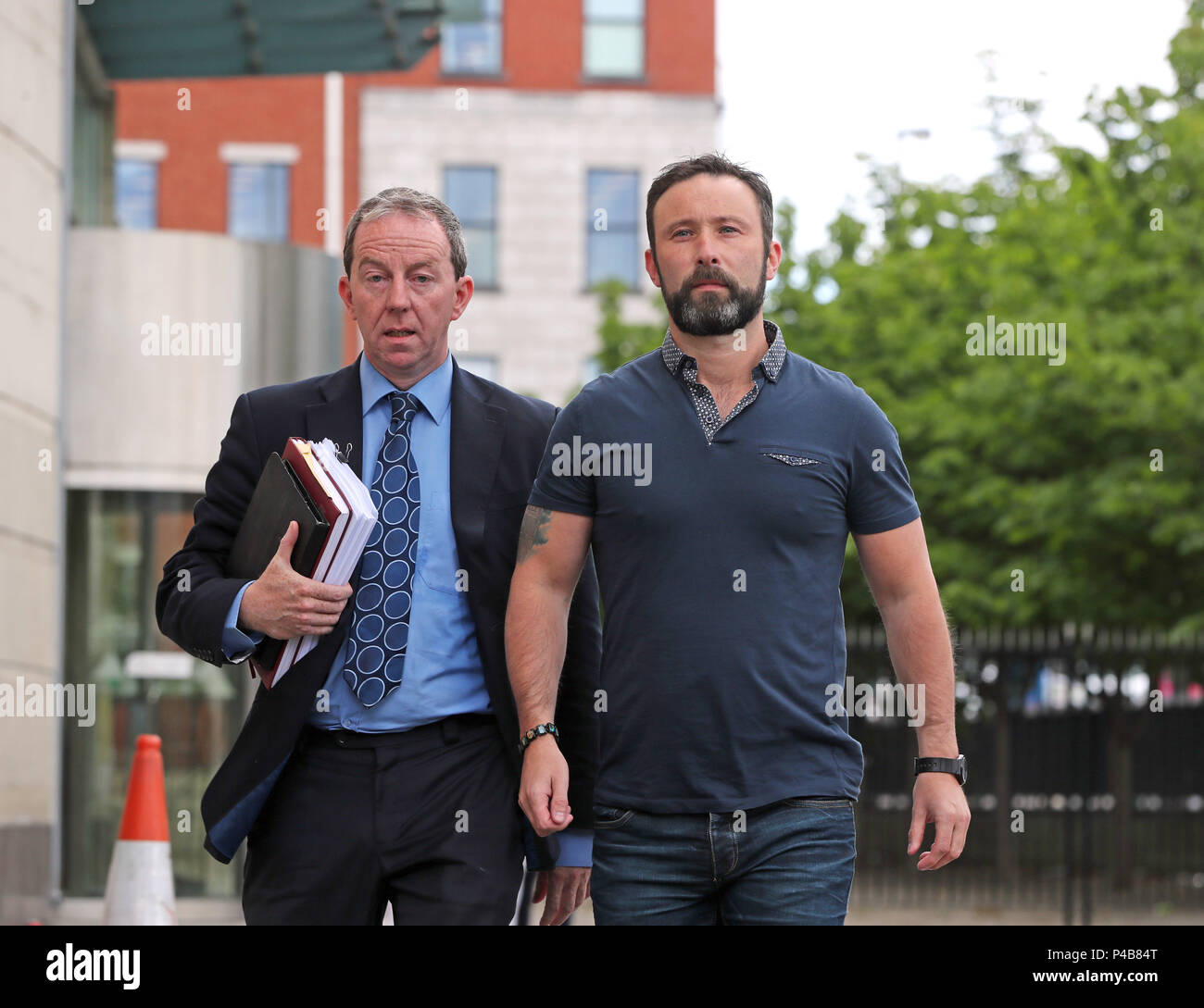 Damien McLaughlin walks free Belfast Crown Court with solicitor Peter Corrigan (left), after prosecutors decided not to appeal against a judge's ruling that part of the evidence was unsafe in the trial over the killing of prison officer David Black. Stock Photo