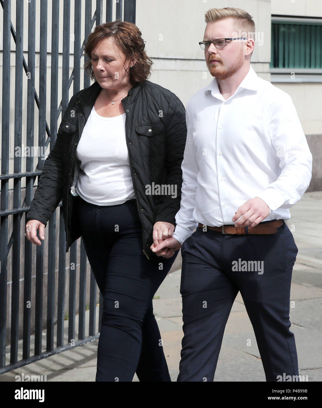 Murdered prison officer David Black's widow Yvonne (left) and other family member leaving Belfast Crown Court after Damien Mclaughlin walks free as prosecutors decided not to appeal against a judge's ruling that part of the evidence was unsafe in the trial. Stock Photo