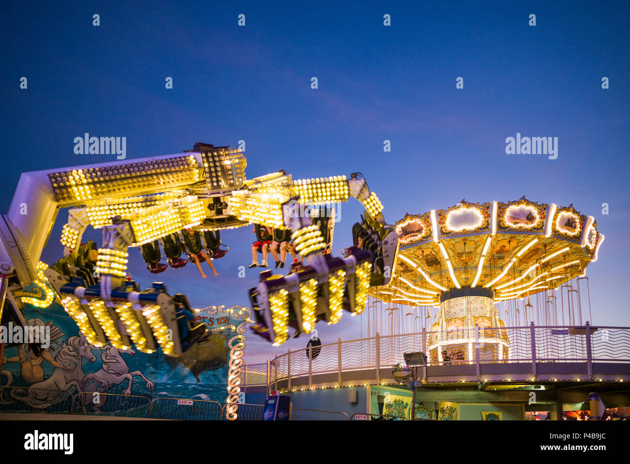 USA, New Jersey, The Jersey Shore, Wildwoods, Wildwoods Beach Boardwalk, amusement park rides, dusk Stock Photo