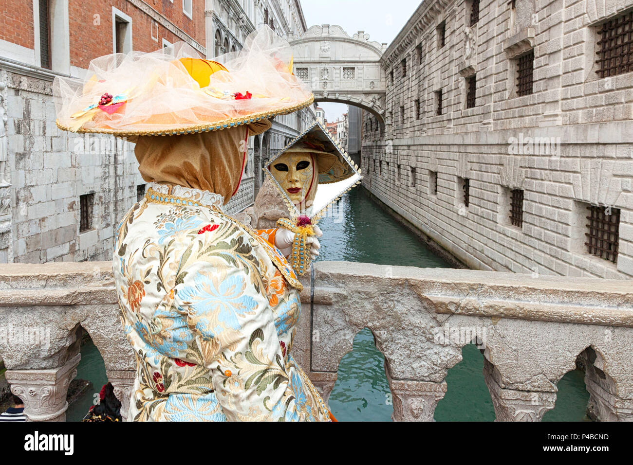 Typical mask of Carnival of Venice in front of Bridge of Sighs, Venice, Veneto, Italy Stock Photo