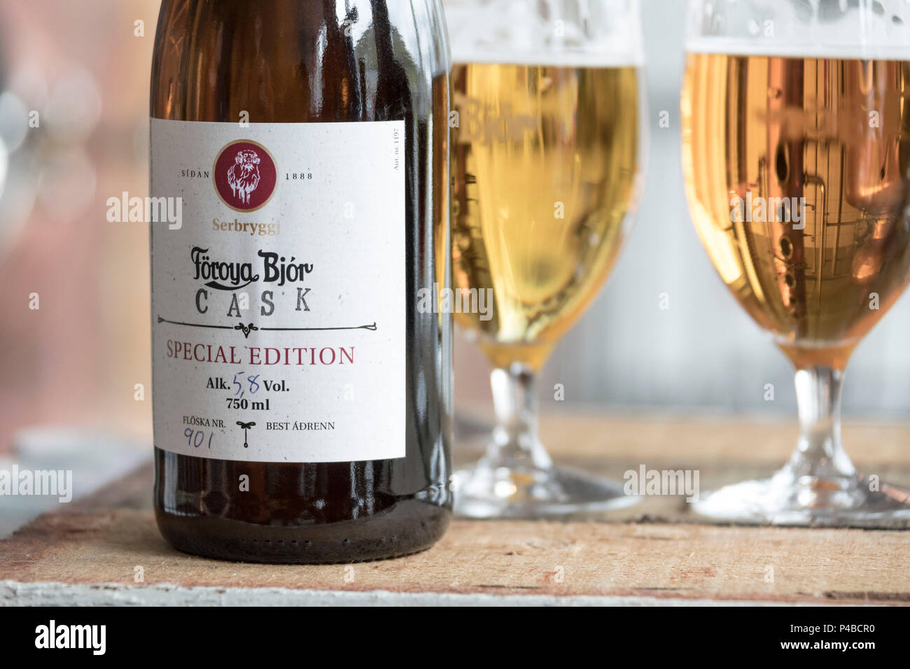 Close up of beer bottle and glasses, Foroya Bjor brewery, Klaksvik, Bordoy Island, Faroe Islands Stock Photo