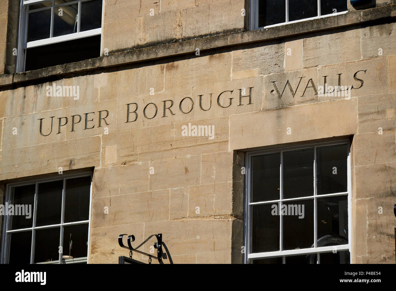 upper borough walls sign carved into old bath stone wall Bath England