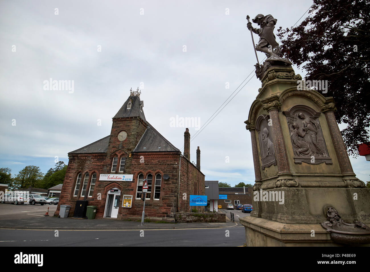 former market hall and Sir Wilfrid Lawson memorial in market square Aspatria Cumbria England UK Stock Photo