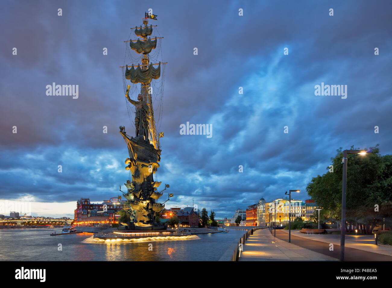 Peter the Great Statue, a 98-metre-high monument to Russian Tsar Peter I, illuminated at dusk. Krymskaya Embankment, Moscow, Russia. Stock Photo