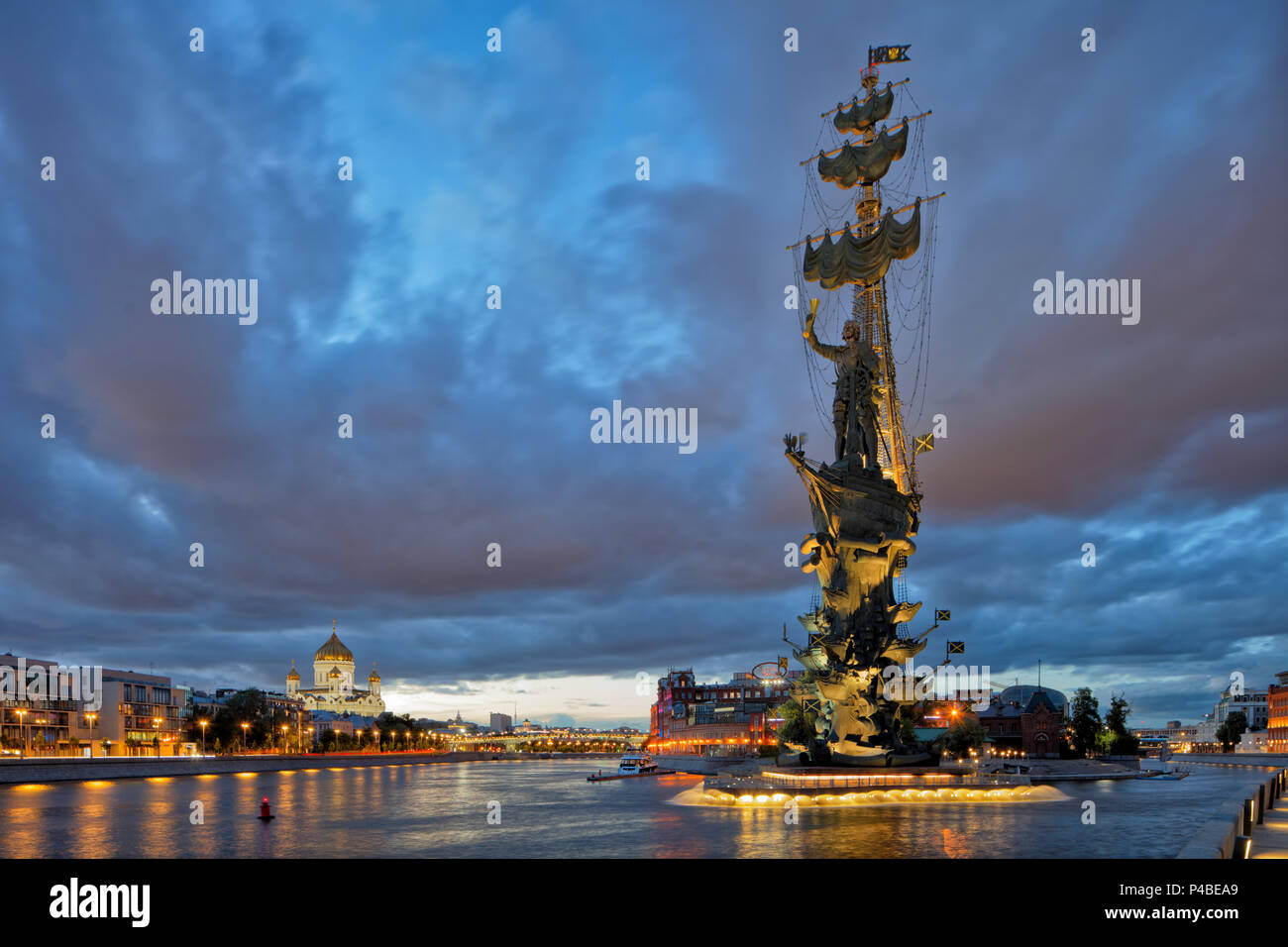 Peter the Great Statue, a 98-metre-high monument to Russian Tsar Peter I, illuminated at dusk. Krymskaya Embankment, Moscow, Russia. Stock Photo