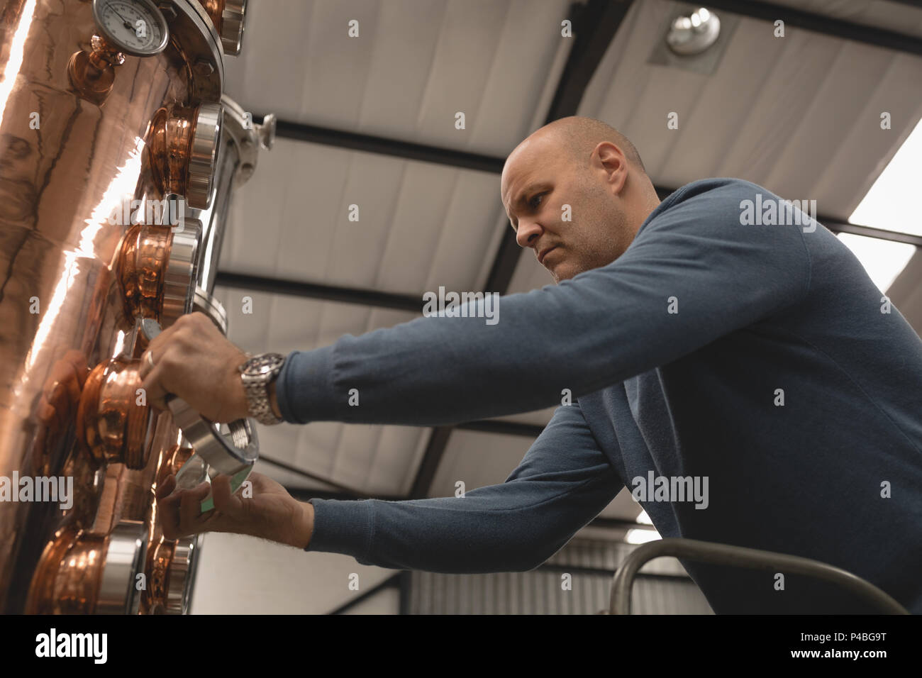 Photo Worker Checking Machine Worker checking gauge hi-res stock photography and images - Alamy