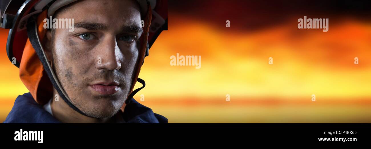 Composite image with firefighter with fire background Stock Photo