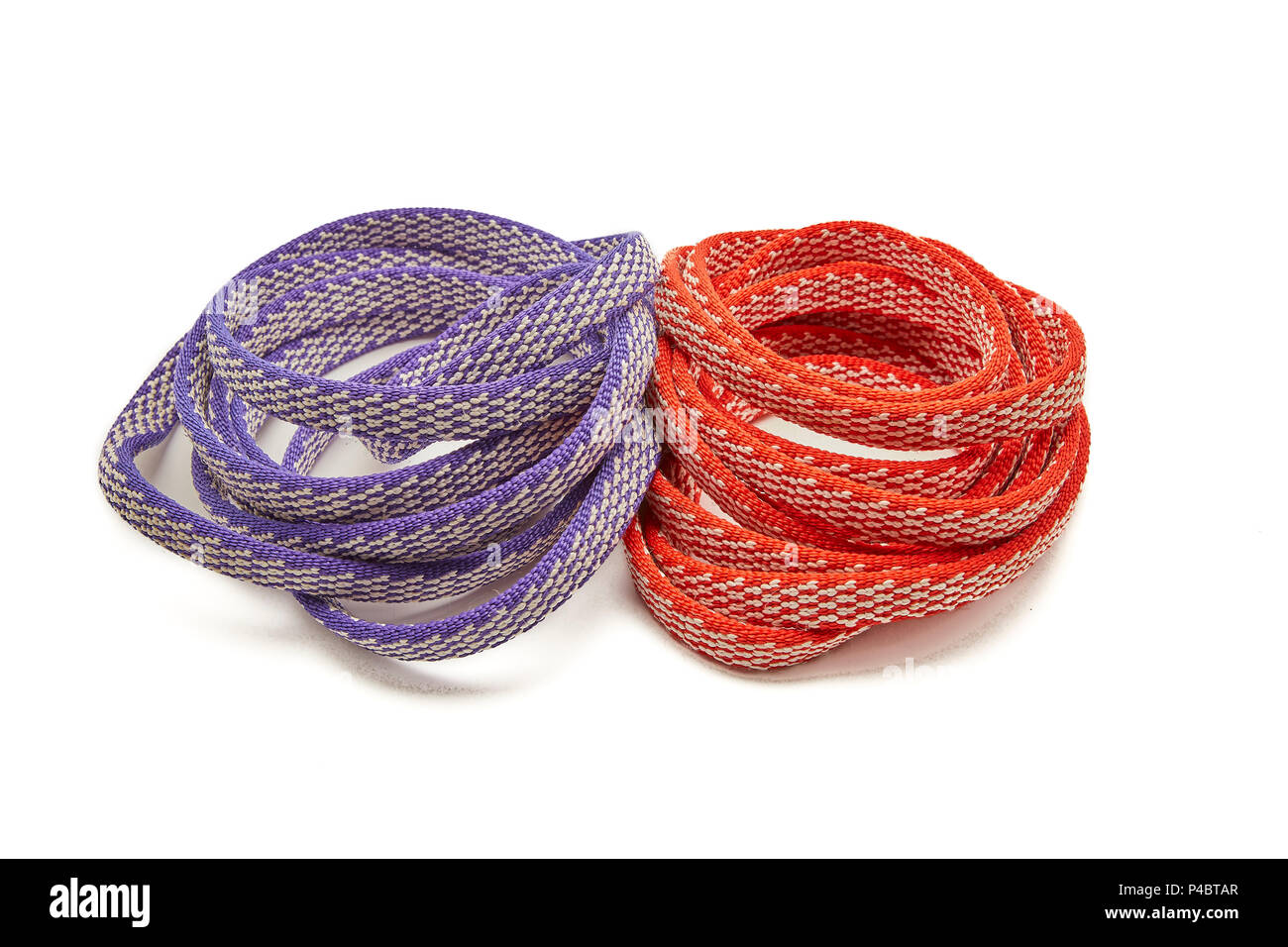Two Ropes, Purple and Red Coiled in a spiral Stock Photo