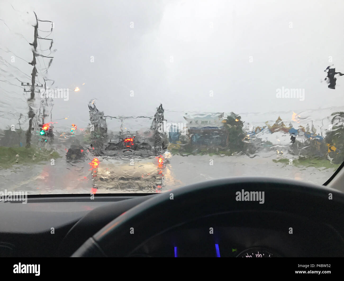 Driving inside car on the highway, Road poor view through car caused by  heavy rain drops Stock Photo - Alamy