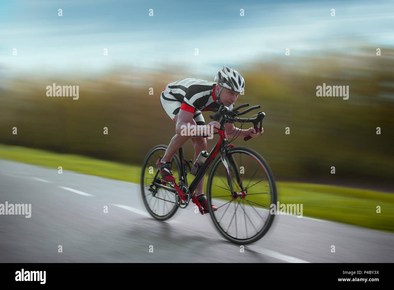 Cyclist rides on bicycle, speed effect, side view Stock Photo Alamy