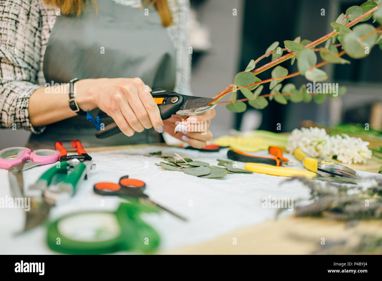 Female florist, bouquet preparation process Stock Photo - Alamy