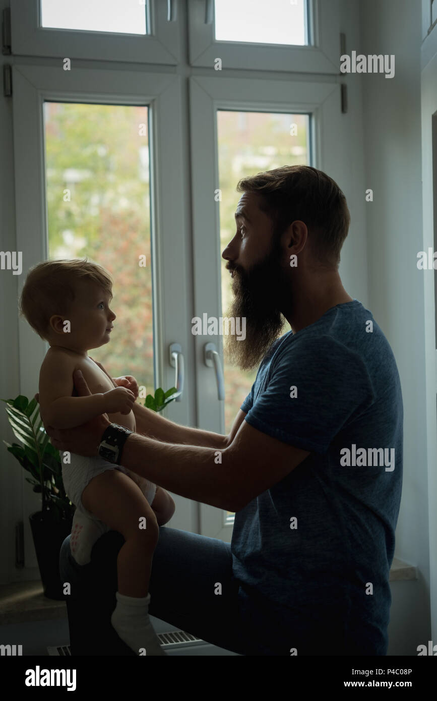 Father playing with his baby Stock Photo